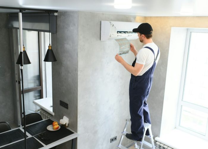 service-man-is-cleaning-repair-and-maintenance-of-air-conditioner-1-1